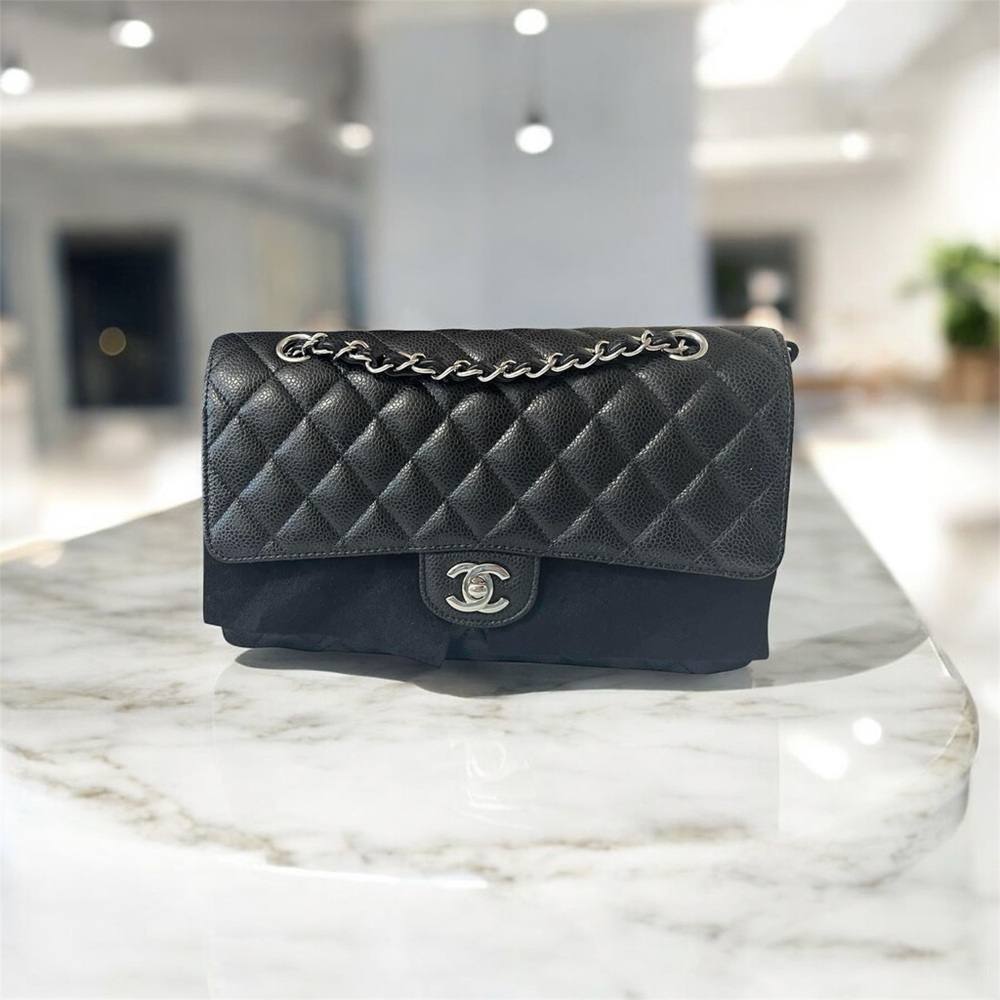 CHANEL Black Quilted Flap Bag with Silver Chain